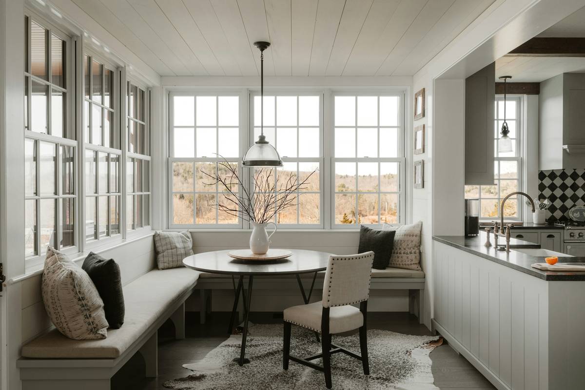 Side-by-side comparison: left shows authentic farmhouse table with breadboard ends and visible grain; right shows mass-produced 'farmhouse' table with painted finish and fake distressing
