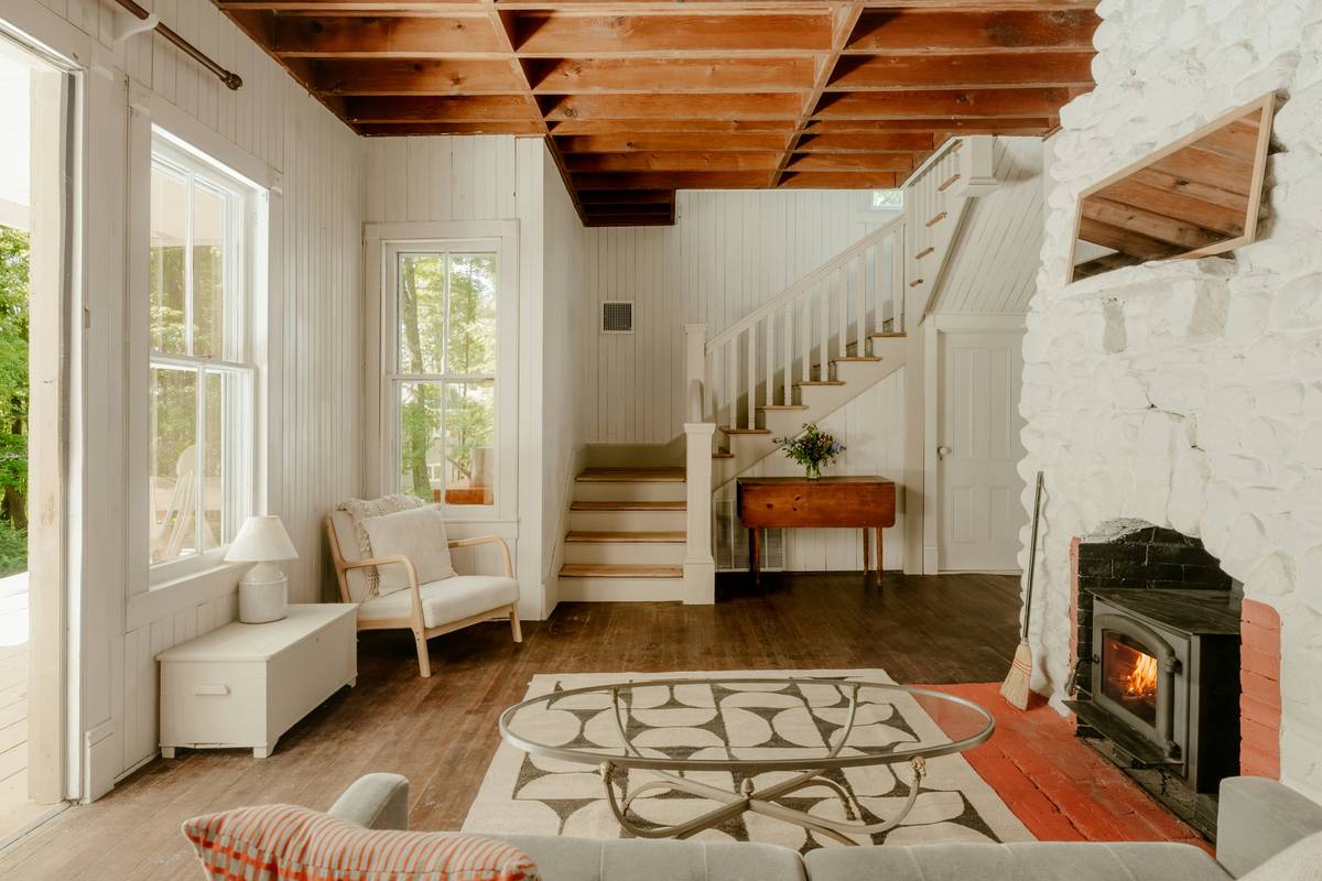 luxury farmhouse furniture styles in a sunlit dining room with oak table and linen chairs